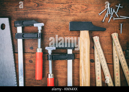 Hand tools and nails on a wooden table Stock Photo