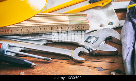 Set of hand tools on a wooden surface Stock Photo