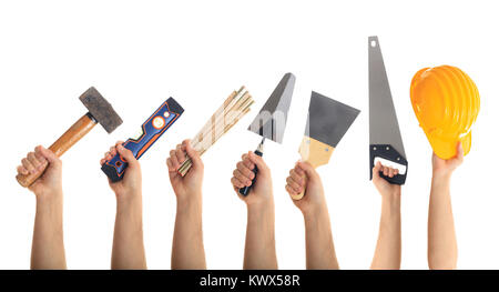 Hands holding hand tools on white background Stock Photo