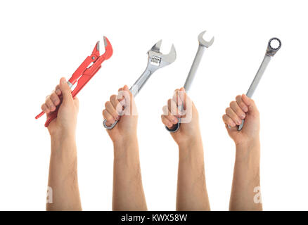 Hands holding hand tools on white background Stock Photo