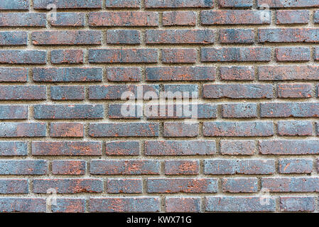 Background from a dark red brick wall Stock Photo