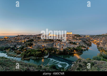 View of Toledo in Spain with the Tagus river after sunset Stock Photo
