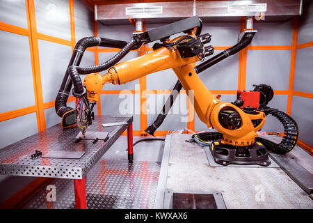 Fibre laser robotic remote cutting system. CNC Laser plasma cutting of metal, modern industrial technology. Stock Photo