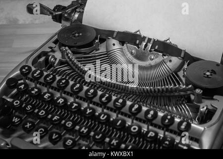 Typewriter ready for use with blank paper installed Stock Photo