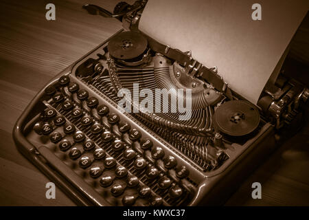 Typewriter ready for use with blank paper installed Stock Photo