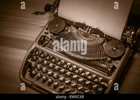 Typewriter ready for use with blank paper installed Stock Photo