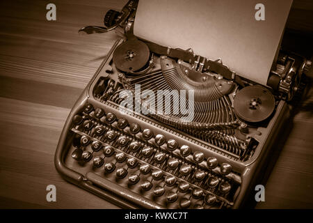 Typewriter ready for use with blank paper installed Stock Photo