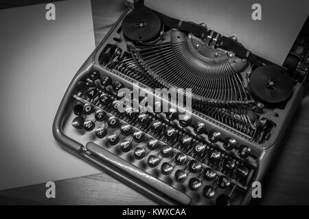 Typewriter ready for use with blank paper installed Stock Photo