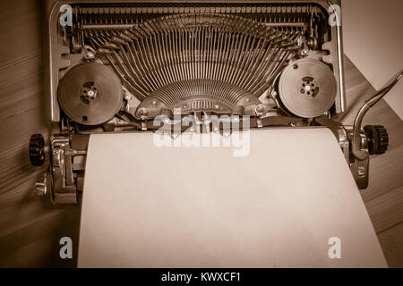 Typewriter ready for use with blank paper installed Stock Photo