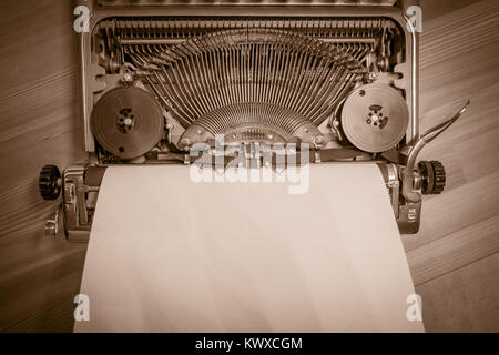 Typewriter ready for use with blank paper installed Stock Photo