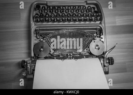 Typewriter ready for use with blank paper installed Stock Photo