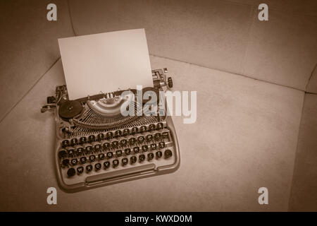 Typewriter ready for use with blank paper installed Stock Photo