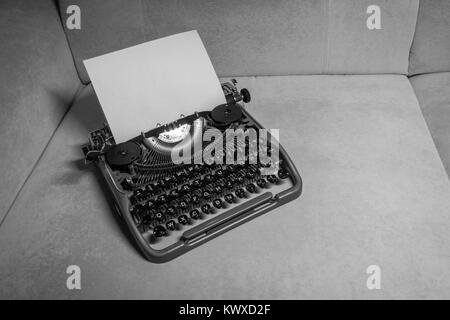 Typewriter ready for use with blank paper installed Stock Photo