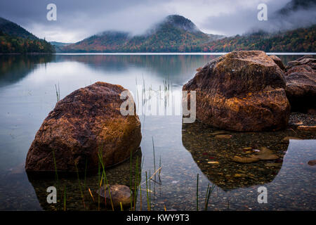 Low clouds settle in around The Bubbles on Jordan Pond in Acadia National Park. Stock Photo