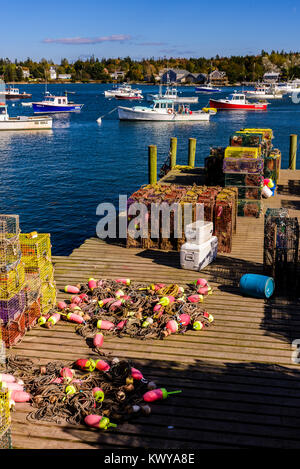 Fishing boats and lobster fishing equipment at wharf in Bernard Maine. Stock Photo