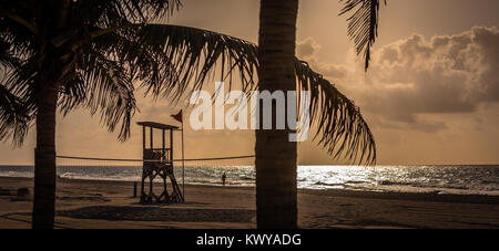 Life Guard Tower silhouetted against the sunset on the beach at Playa Del Carmen, Mexico Stock Photo