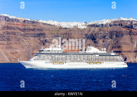 Cruise ship liner near the Santorini island. Santorini classically Thera or Thira is an island in the southern Aegean Sea, Cyclades in Greece. Stock Photo