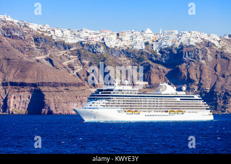 Cruise ship liner near the Santorini island. Santorini classically Thera or Thira is an island in the southern Aegean Sea, Cyclades in Greece. Stock Photo