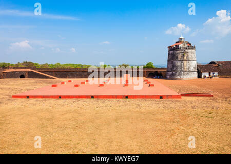 Fort Aguada and its lighthouse is a portuguese fort standing on Sinquerim Beach in Goa, India Stock Photo