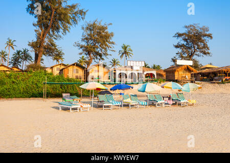 Beach huts and sunbeds on Arambol beach in north Goa, India Stock Photo