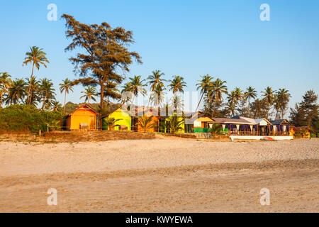 Beach huts and sunbeds on Arambol beach in north Goa, India Stock Photo