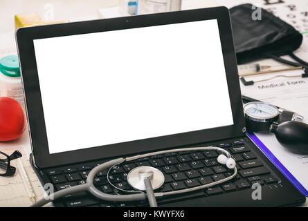 Laptop with white screen on a doctor's desk Stock Photo