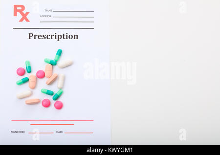 Pills on a blank prescription on white background Stock Photo