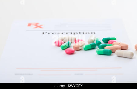 Pills on a blank prescription on white background Stock Photo