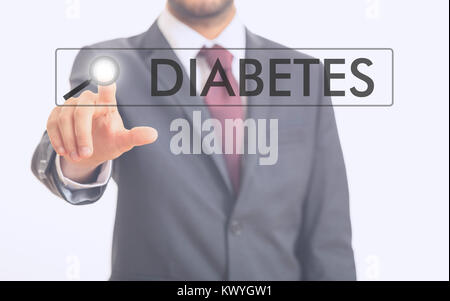 Man pointing at word diabetes on white background Stock Photo