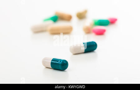 Capsules close up on various pills background Stock Photo