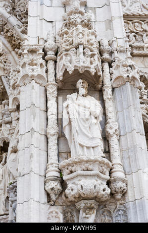 A statue on the wall of the Jerónimos Monastery which is a former monastery of the Order of Saint Jerome near the Tagus river in the parish of Belém. Stock Photo