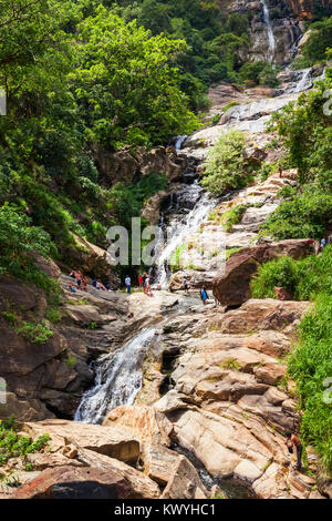 The Ravana Falls or Ravana Ella waterfalls is a popular sightseeing attraction near Ella, Sri Lanka. Ravana Falls ranks as one of the  widest falls in Stock Photo