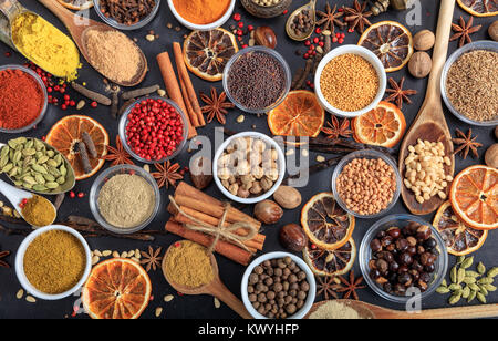 Composition of various spices on a black background Stock Photo