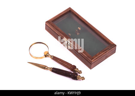 knife and loupe for letters over a white background Stock Photo