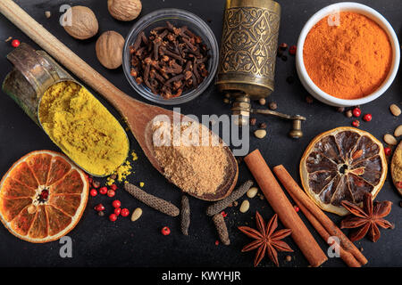 Composition of various spices on a black background Stock Photo