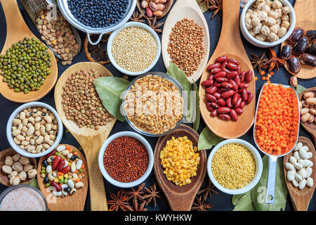 Composition of various kinds of legumes on black background Stock Photo