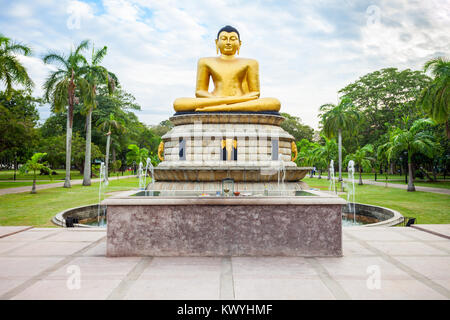 Buddha statue at the Viharamahadevi Park or Victoria Park, public park located in Colombo near the National Museum in Sri Lanka Stock Photo