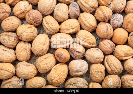 Walnuts in shell full background Stock Photo