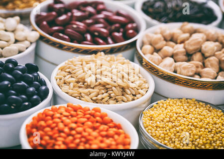 Variety of raw legumes and rices Stock Photo