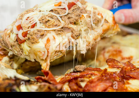 Close up Italian Pizza about cheese it stick. Selective focus. Food, italian cuisine and cooking concept. Stock Photo