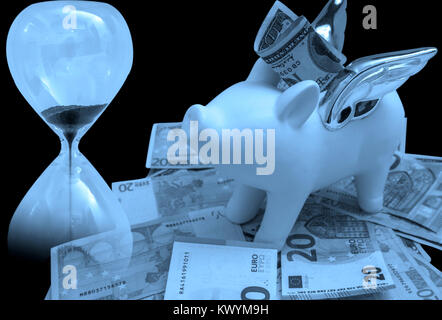 Time is money business concept. Piggy bank and hour glass monochrome background Stock Photo