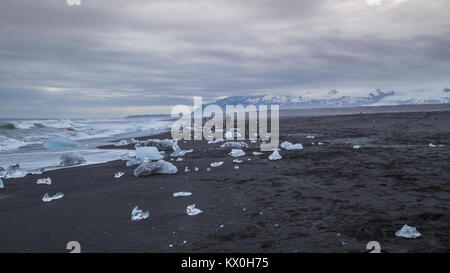 Lumps of ice washed up on Diamond Beach at the Glacier Lagoon Jökulsárlón on the edge of Vatnajökull National Park in Iceland Stock Photo