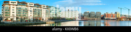 DUBLUN, IRELAND- February 4, 2017: Modern Dublin Docklands or Silicon Docks. Panorama of modern apartments, Grand Canal Square, The Bord Gais Energy T Stock Photo