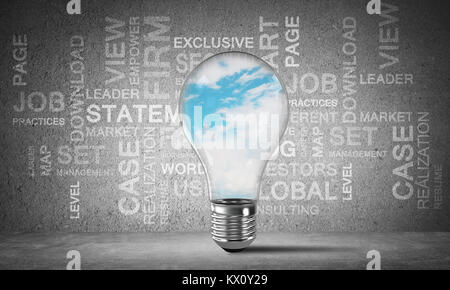 Glass lightbulb with skyscape inside with business related terms on dark grey wall on background. 3D rendering. Stock Photo