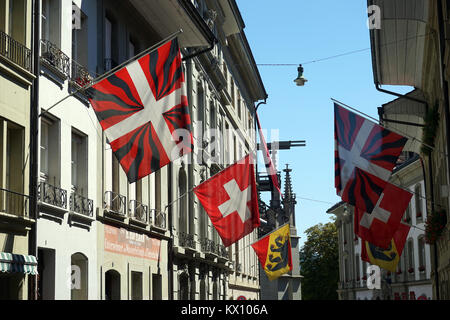 BERN, SWITZERLAND - CIRCA AUGUST 2015 Flags on the street Stock Photo