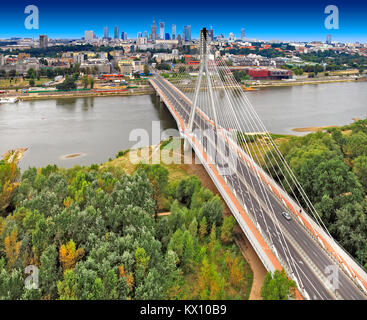 Poland, Mazovia province, Warsaw - 2012/09/01: Panoramic view of the city center with the Swietokrzyski Bridge over Vistula river