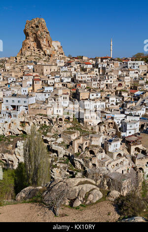 View over the town of Ortahisar and cave dwellings with the Mount Erciyes in the background, in Cappadocia, Turkey. Stock Photo