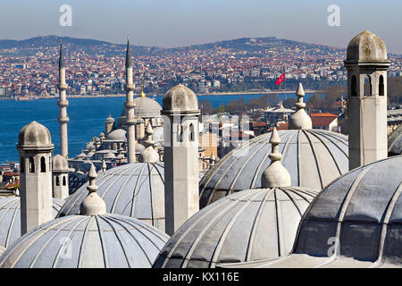 View over Istanbul through the domes and chimneys of the Suleymaniye Complex. Stock Photo