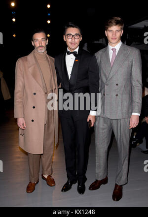 Richard Biedul, left, Hu Bing and Toby Huntington-Whiteley on the front row during the John Lawrence Sullivan Autumn/ Winter 2018 London Fashion Week show at BFC Show Space, London. PRESS ASSOCIATION Photo. Picture date: Saturday 6 January, 2018. See PA story CONSUMER Fashion. Photo credit should read: Isabel Infantes/PA Wire Stock Photo