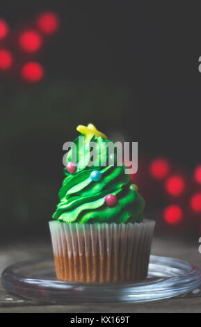 Homemade cupcake decorated as christmas tree; christmas or new year background with copy space Stock Photo